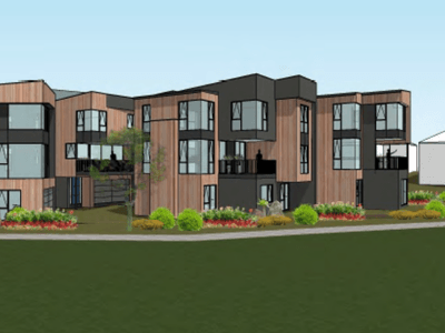 Contemporary apartment building with wood and dark paneling, large windows, and a landscaped front yard with shrubs and a tree.
